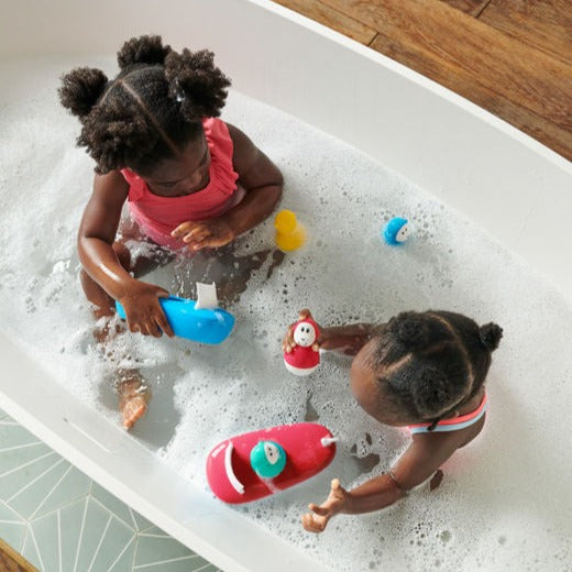 Yellow and white silicone boat set with bobbing monkey.