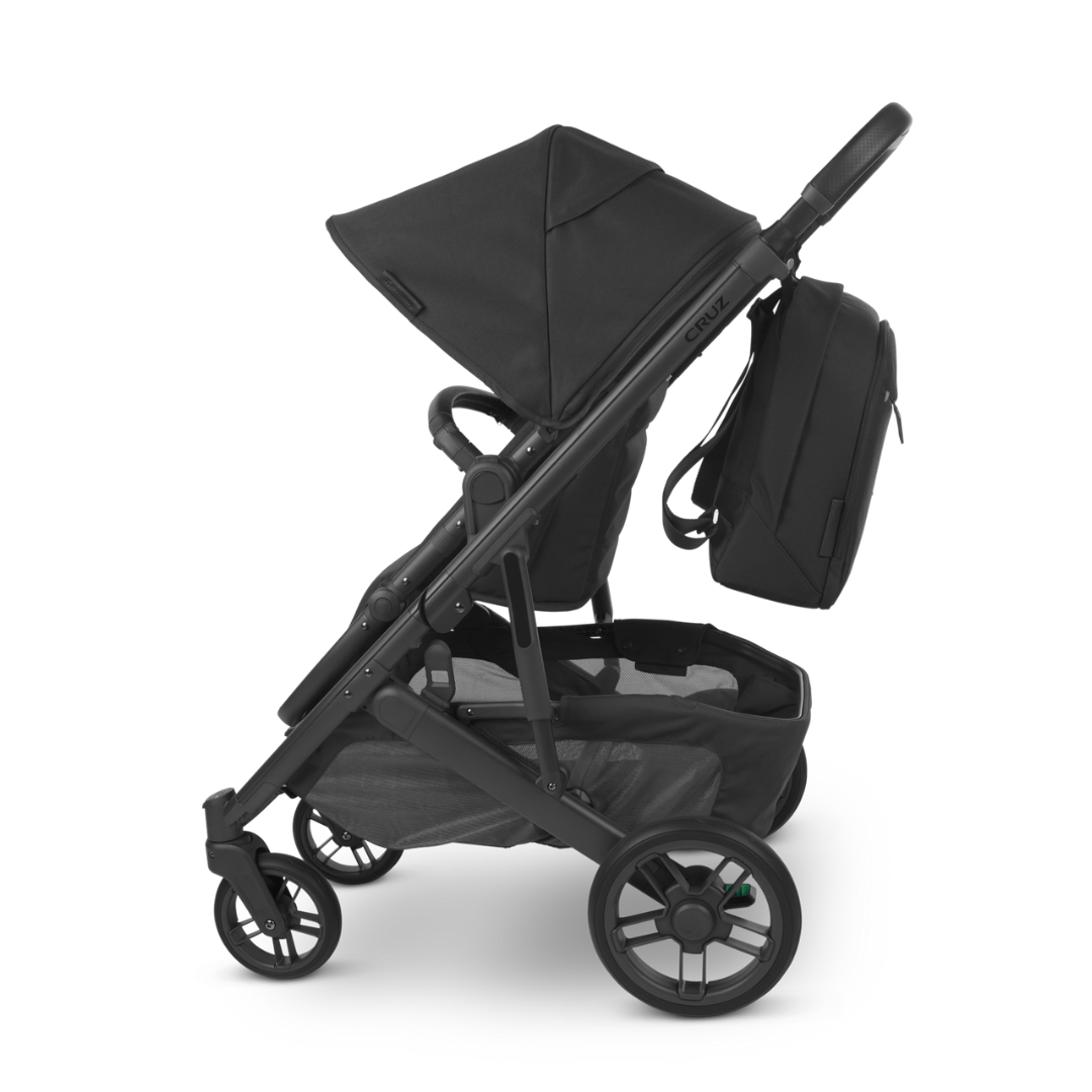Black Changing Back Pack or Nappy Bag with Black leather handle shown on stroller.