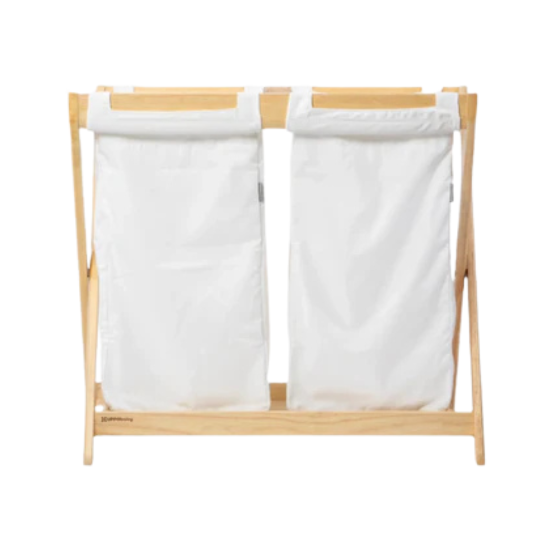 UPPAbaby Bassinet Hamper Insert shown on a natural frame.