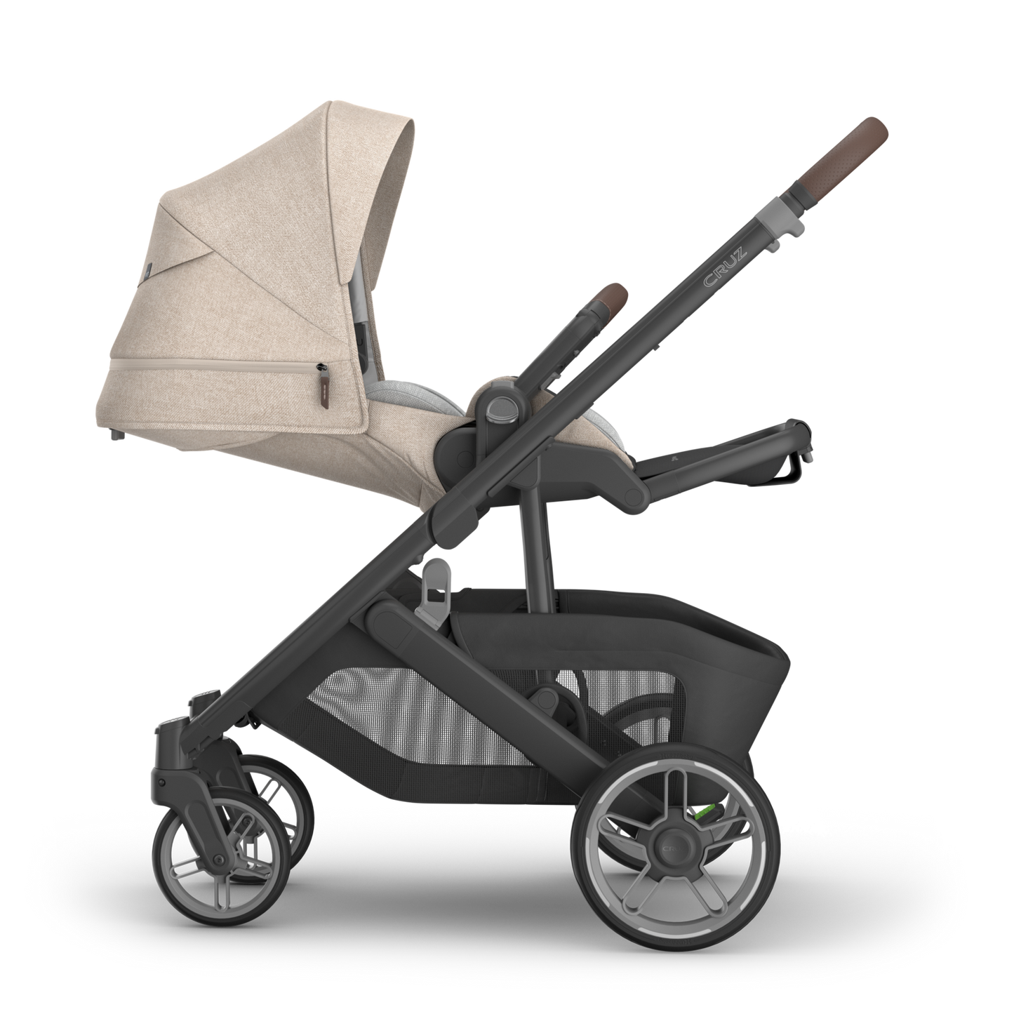 UPPAbaby Cruz v3 in beige canopy and black stroller frame on a white background showing stroller in newborn position.
