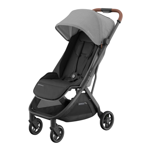 Travel stroller with charcoal canopy, black frame and tan leather handle.