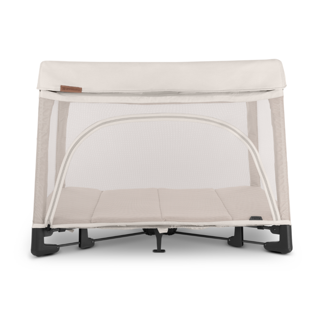 UPPAbaby Remi Port a Cot Charlie Sand/Cream Coloured Fabric.