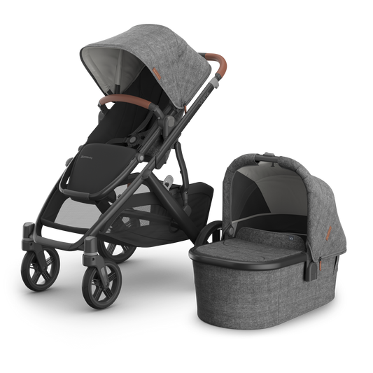 UPPAbaby Vista V3 Greyson Stroller. Charcoal Grey Fabric, Carbon Frame and Chestnut leather handle and bumper bar accents.