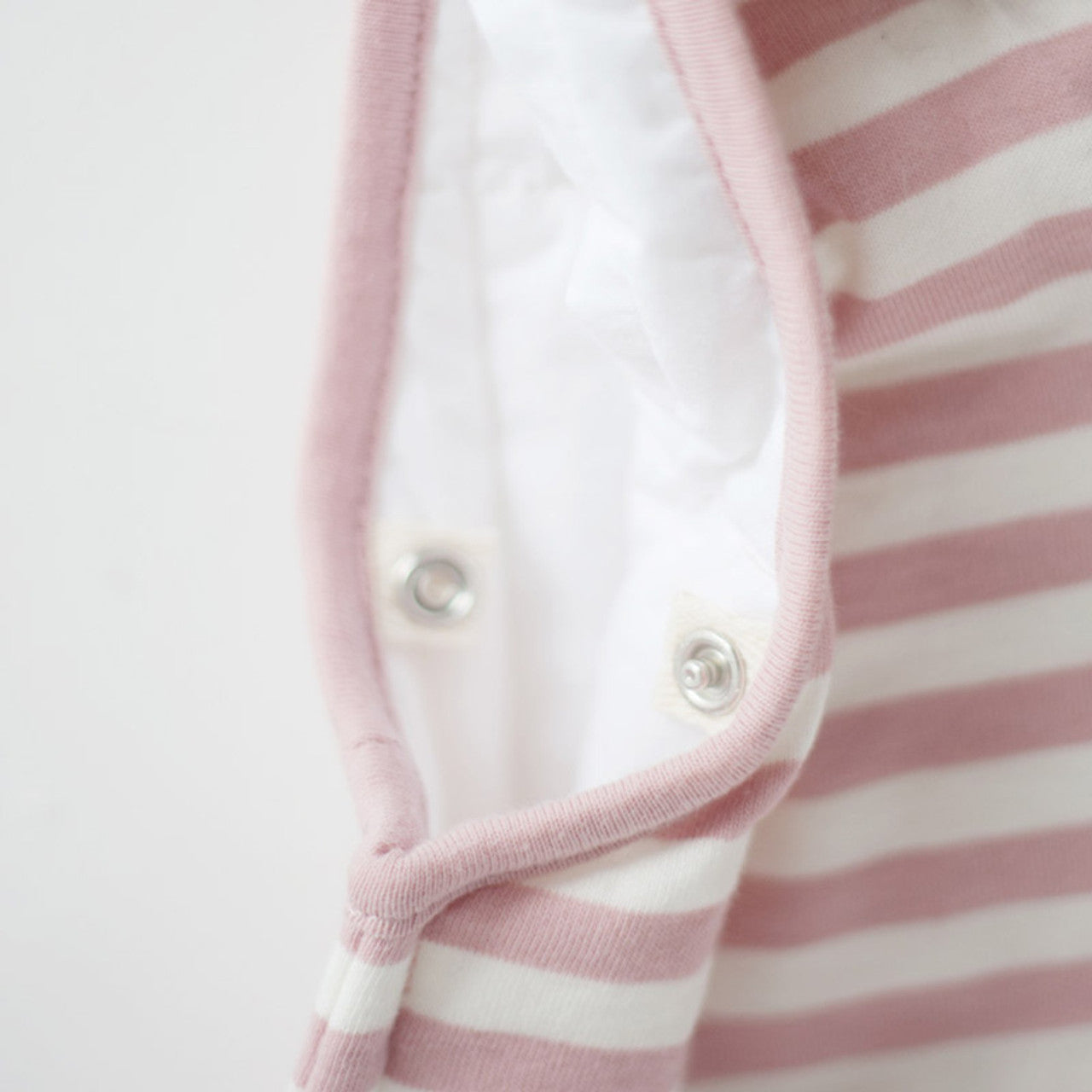 Woolbabe Duvet Side Zip Sleeping Bag in soft Dusk Pink and White Stripe. 