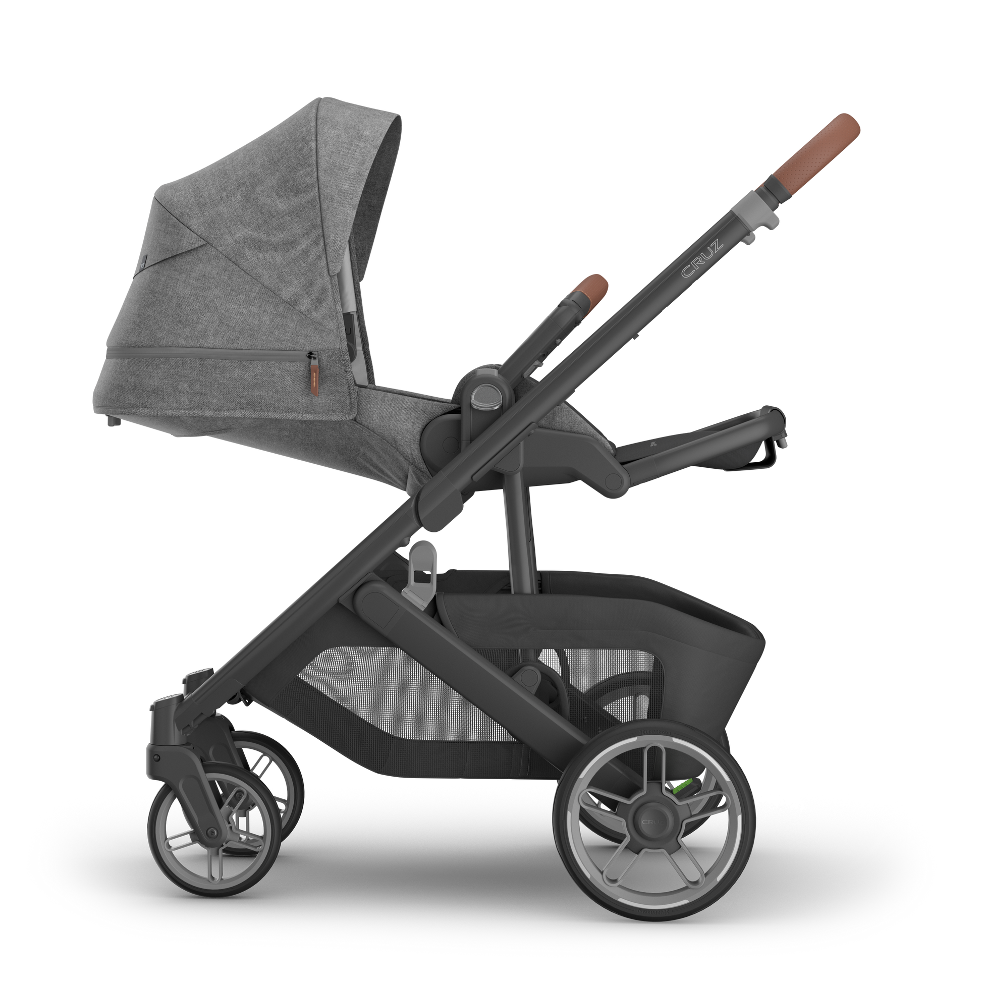 UPPAbaby Cruz V3 stroller with charcoal canopy and carbon frame with tan leather accents side on on a white background. 