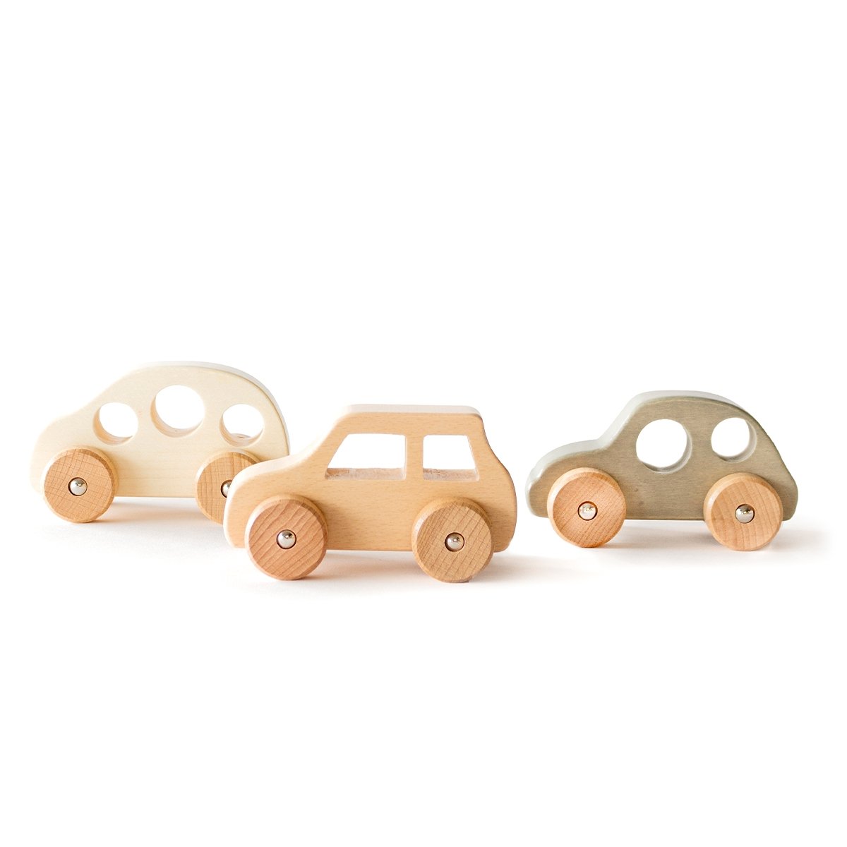 Set of three wooden toy cars on a white background