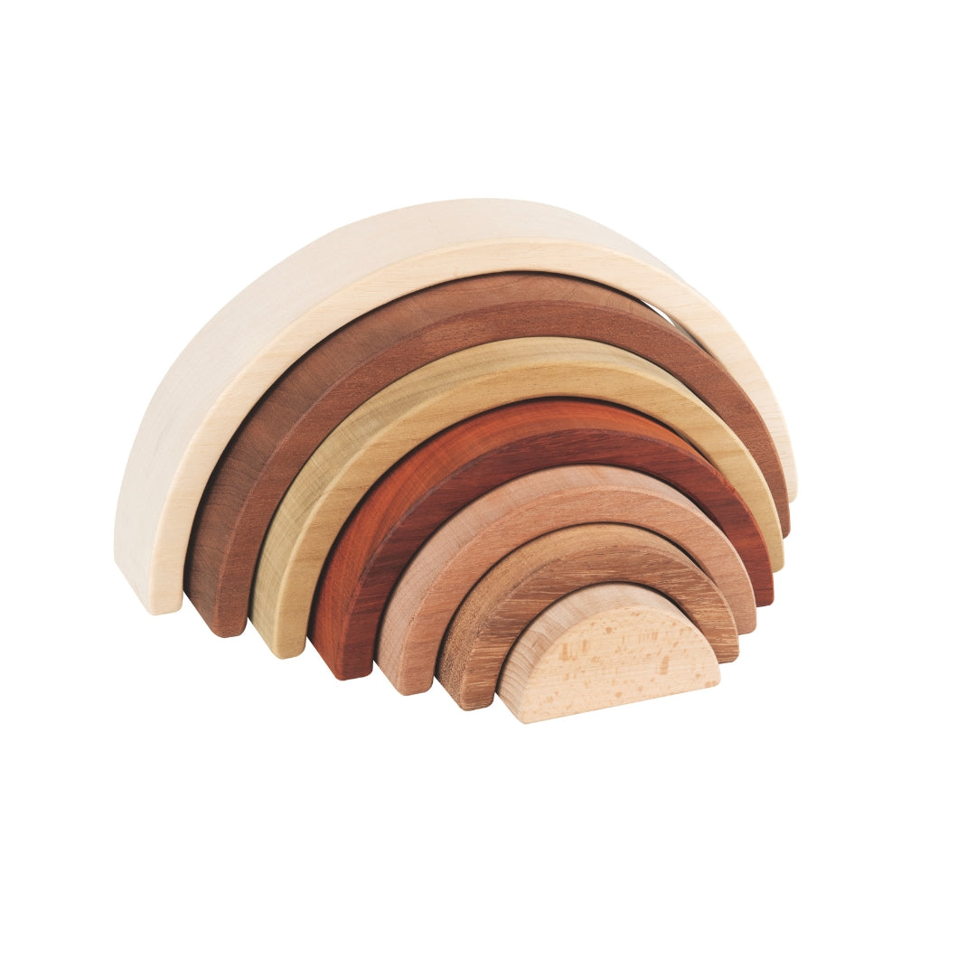 Set of wooden rainbow-shaped blocks on a white background