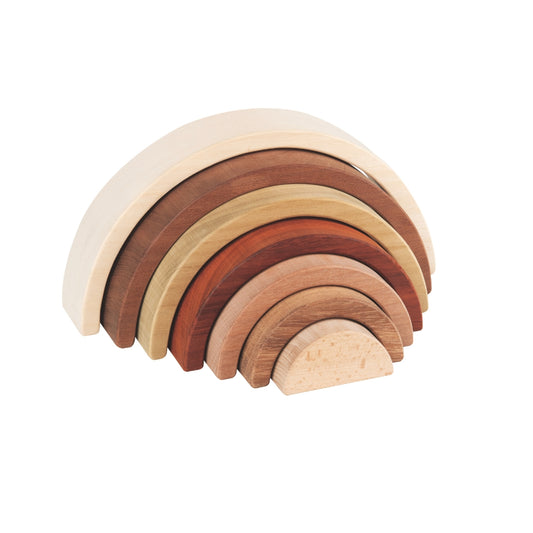 Set of wooden rainbow-shaped blocks on a white background