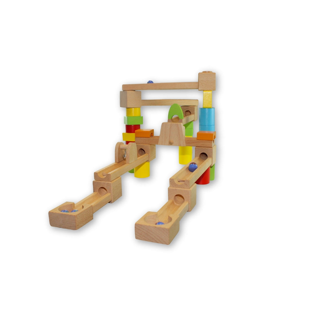 Wooden marble run toy with colorful blocks on a white background