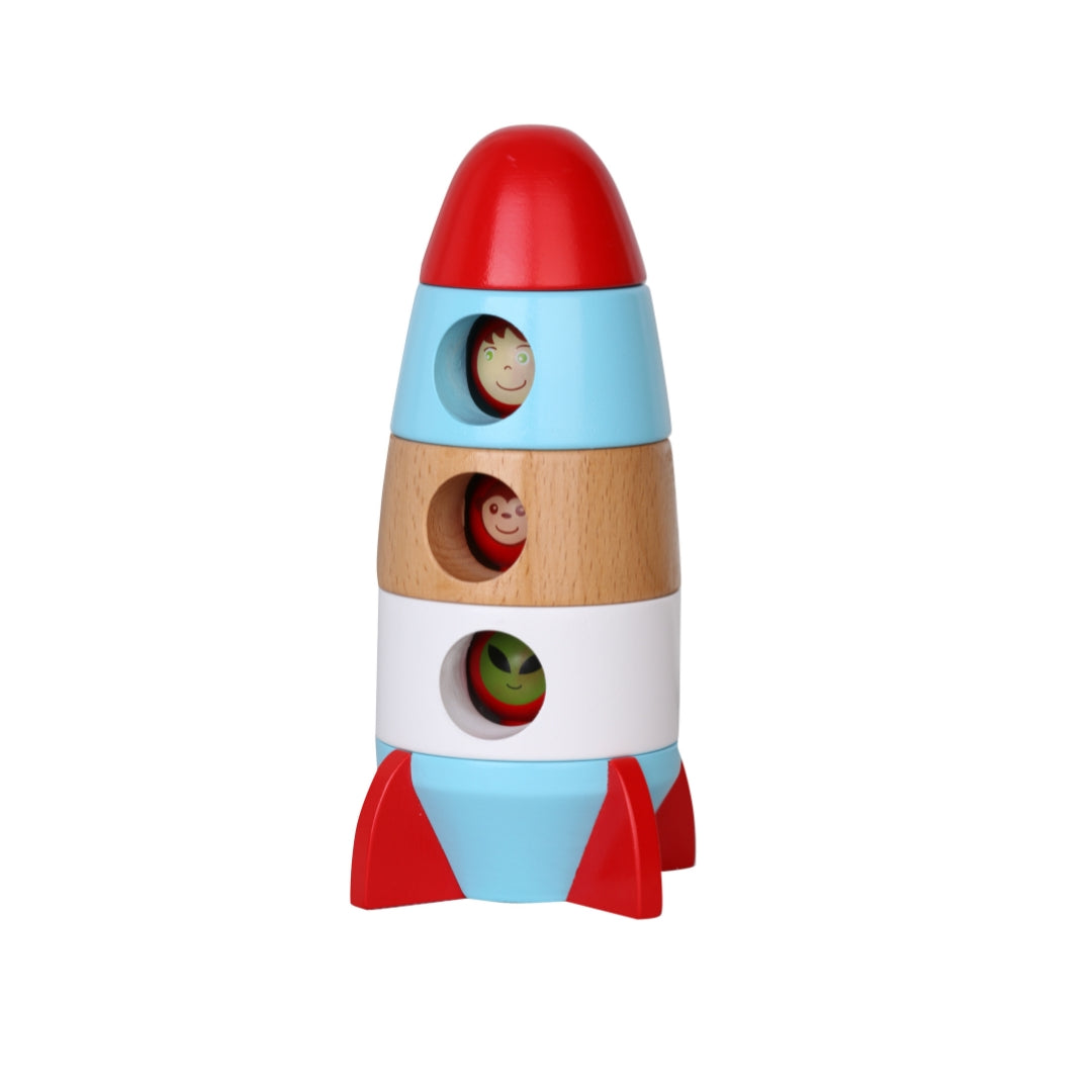 Colourful wooden toy rocket with different coloured sections on a white background