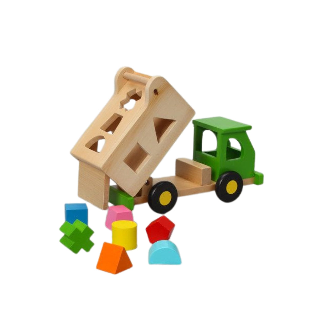 Wooden toy truck with a scoop and colorful blocks on a white background
