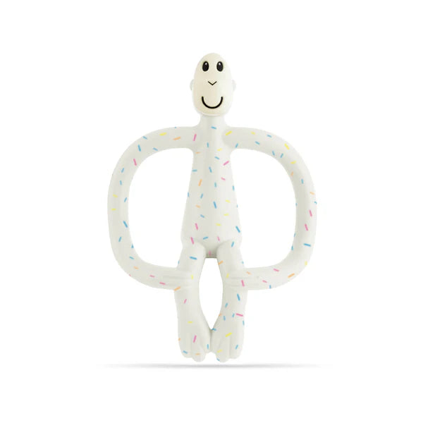 White teething toy with colourful sprinkles on a white background