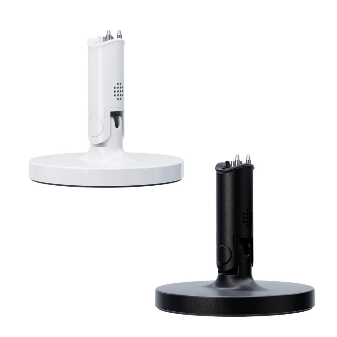 One White and one Black Nanit Flex stand bases on white background