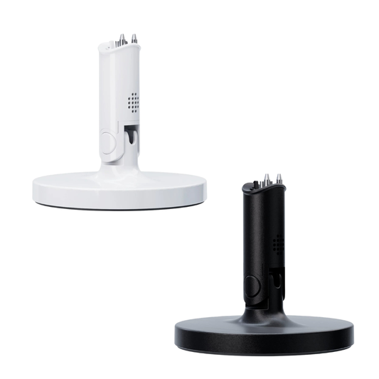 One White and one Black Nanit Flex stand bases on white background