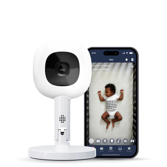 Smart home baby security camera with smartphone displaying a child's video feed on a white background