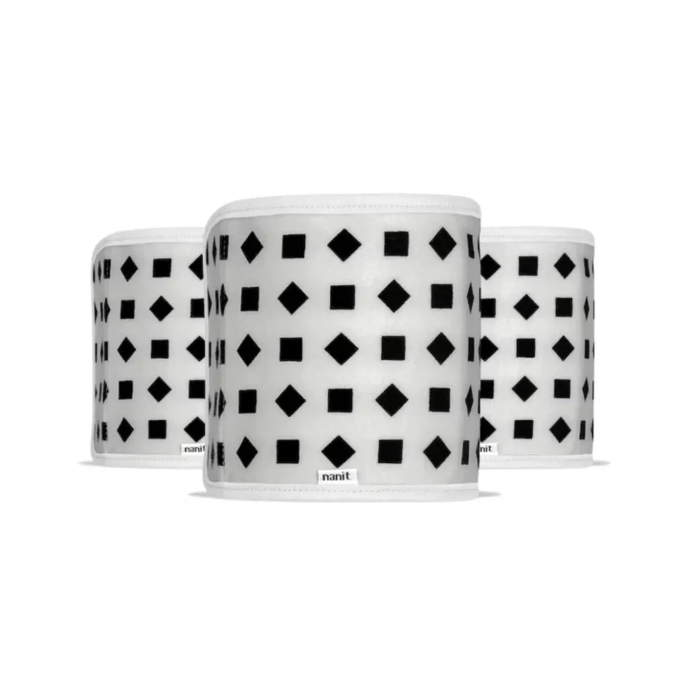 Three white breathing bands with black geometric pattern on a white background