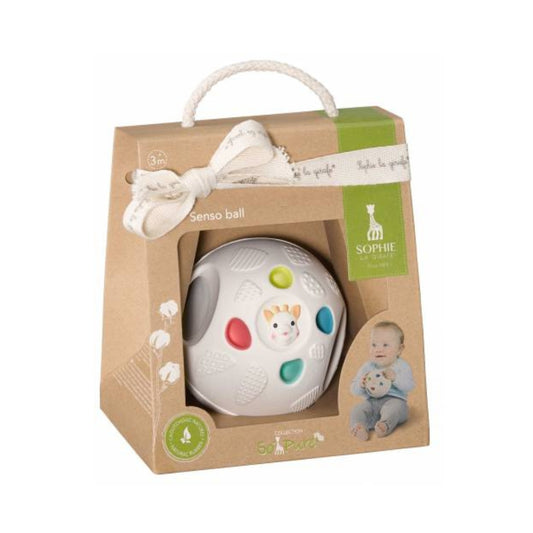 Baby ball toy in a decorative box with a bow on a white background