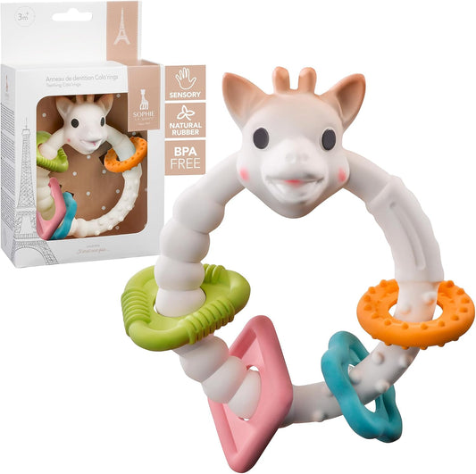 Colourful Sophie la Girafe shaped teething ring with packaging on a white background