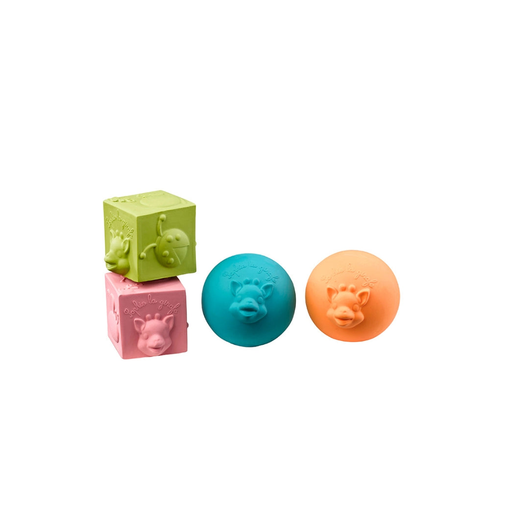 Colourful bath toys with animal faces on a white background