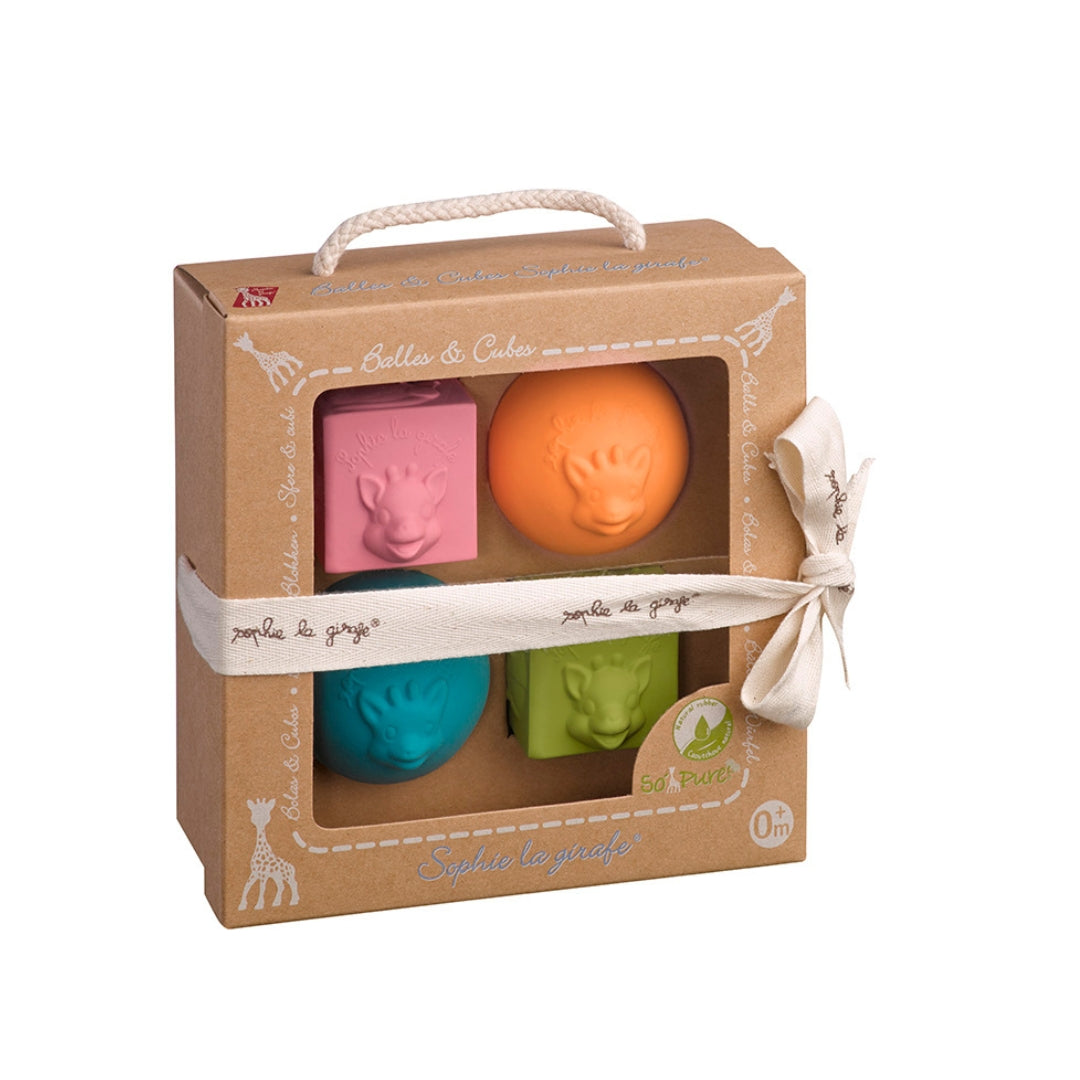 Set of colorful bath toys in a cardboard gift box with a ribbon on a white background
