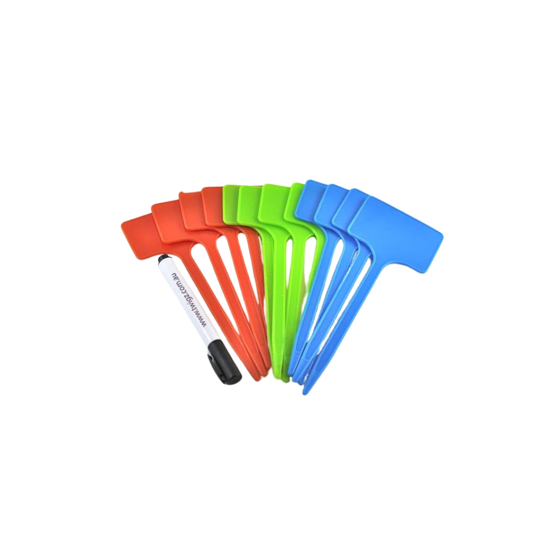 Set of colourful plastic plant markets with a marker on a white background