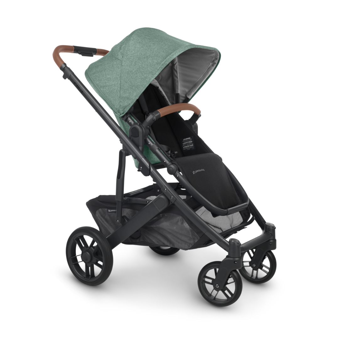 UPPAbaby Cruz V2 Stroller in Gwen Green Melange Fabric, Carbon Frame and Saddle Leather detail on handle and bumper bar. 