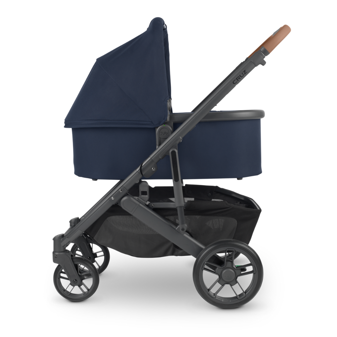 UPPAbaby Navy Blue V2 Bassinet  and carbon frame with chestnut leather accents. 