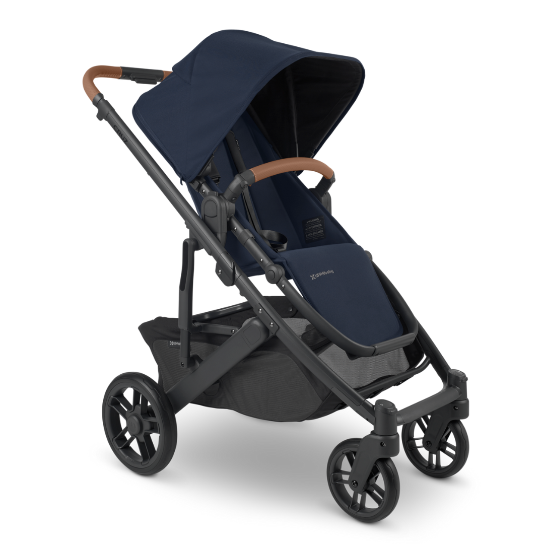 UPPAbaby Navy Blue Cruz V2 Stroller with carbon frame and chestnut leather accents. 