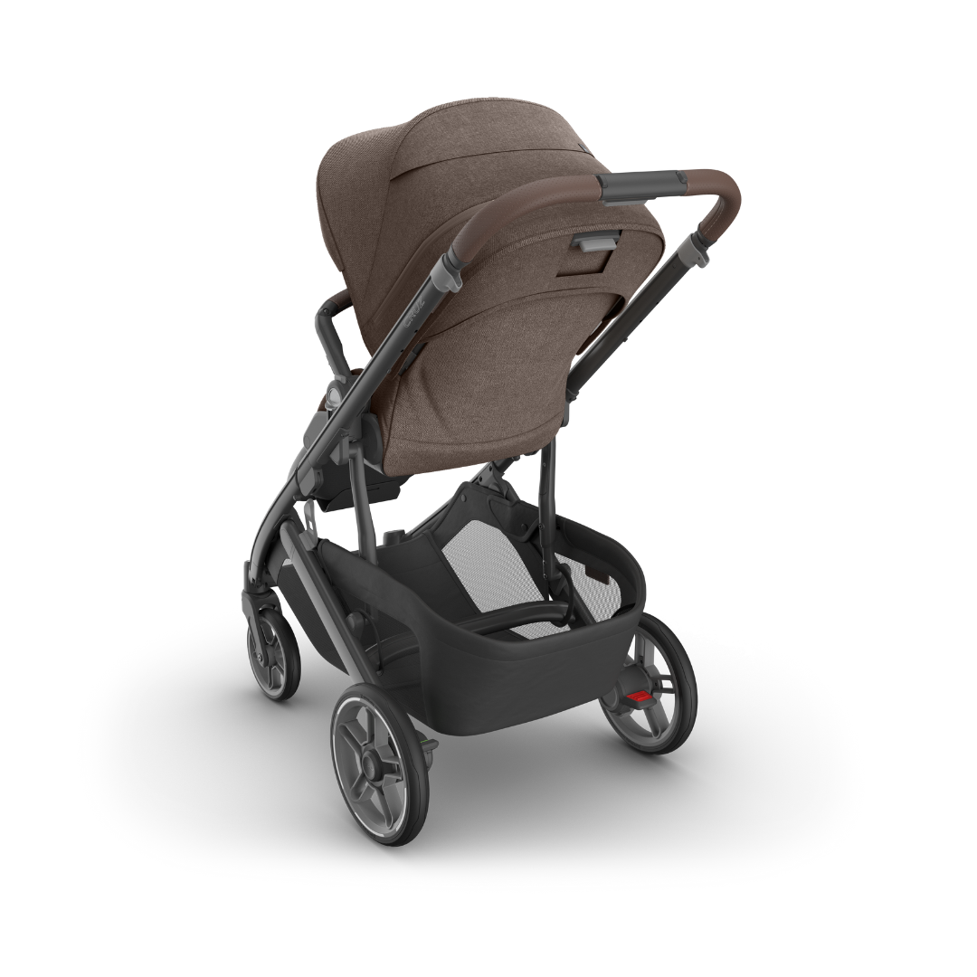 Stroller with Carbon black frame, Mocha melange fabric and chestnut leather accents shown from the back. 