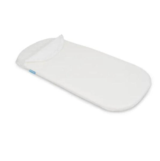 White mattress cover shown on UPPAbaby Bassinet Mattress. 