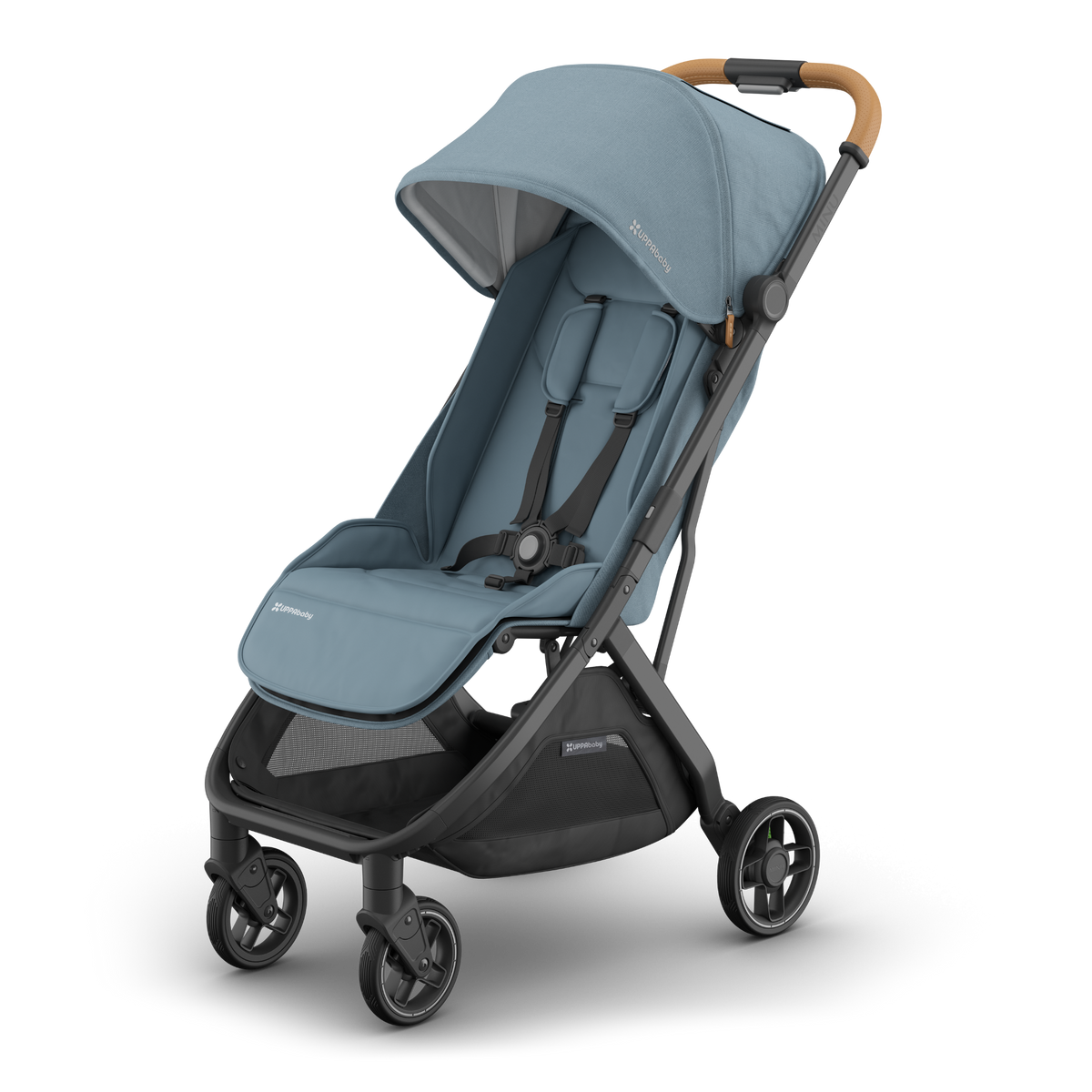 Travel stroller with blue fabric seat and canopy. Black frame and tan leather handle. Side view. 