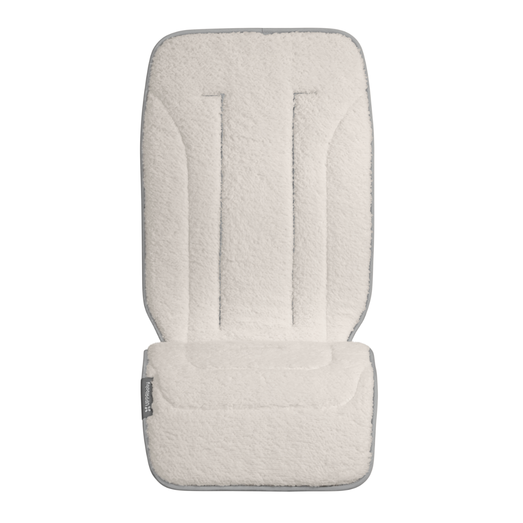 Liner showing white fluffy side. 