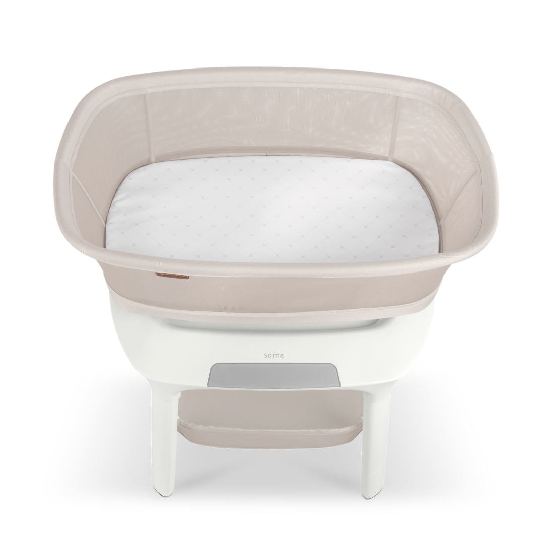 UPPAbaby sand coloured mesh  baby bassinet with white legs showing inside. the white bassinet mattress on a white background.
