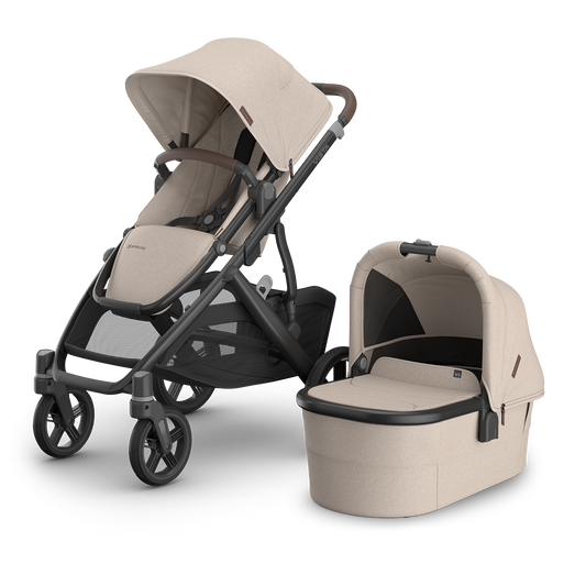 UPPAbaby stroller with carbon frame and chestnut leather accents and beige/sandstone fabric.  