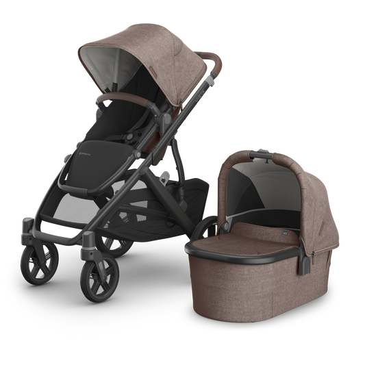 UPPAbaby Vista V3 Pram with carbon frame, brown melange fabric on the seat  and bassinet with brown leather accents.   Showing toddler seat and bassinet. 