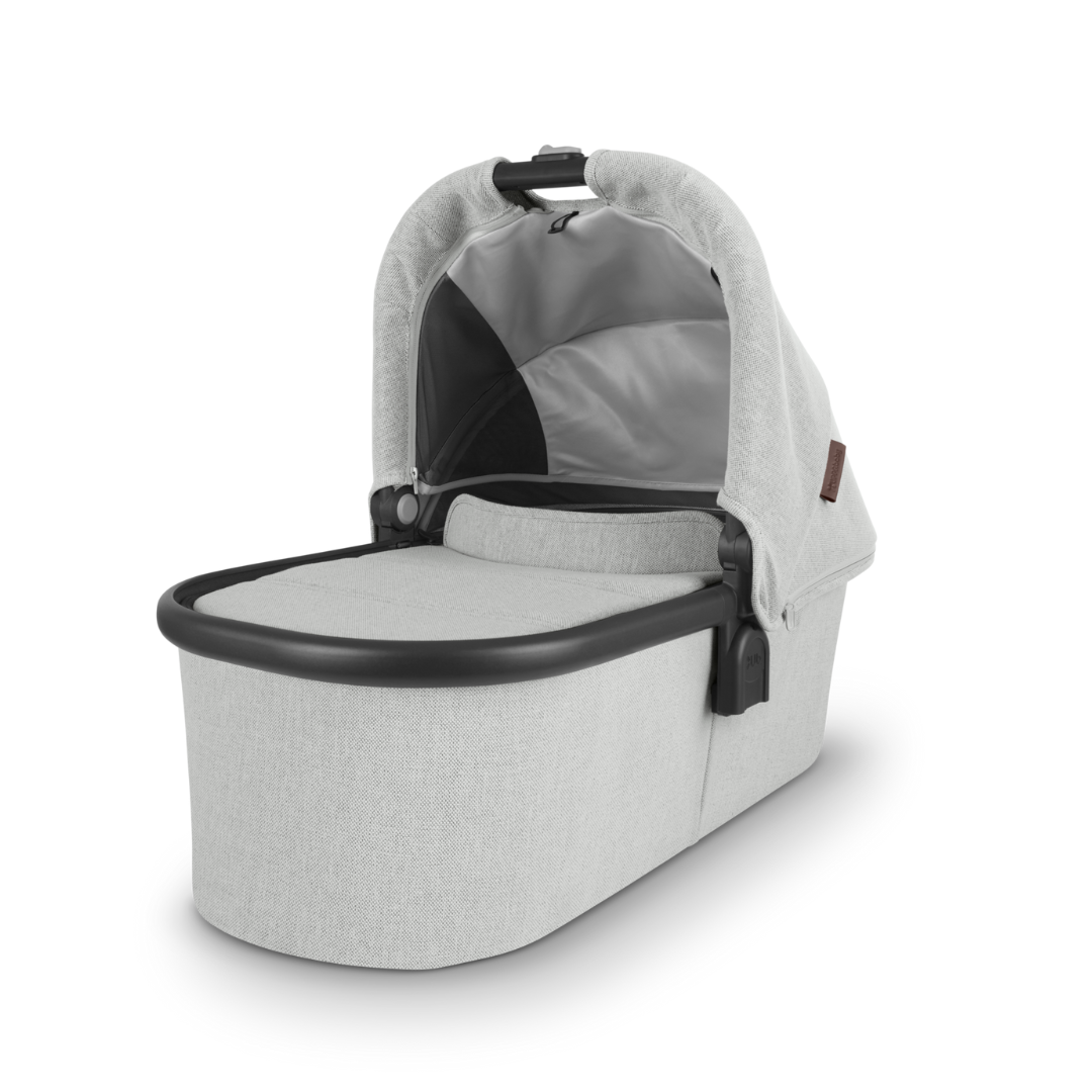 UPPAbaby Cruz V2 with Bassinet Grey Chenille fabric with carbon frame and chestnut leather accessories. 