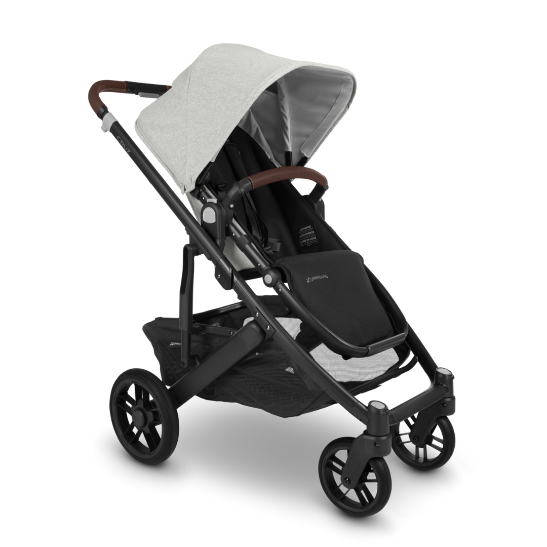 UPPAbaby Cruz V2 with Bassinet Grey Chenille fabric with carbon frame and chestnut leather accessories. 