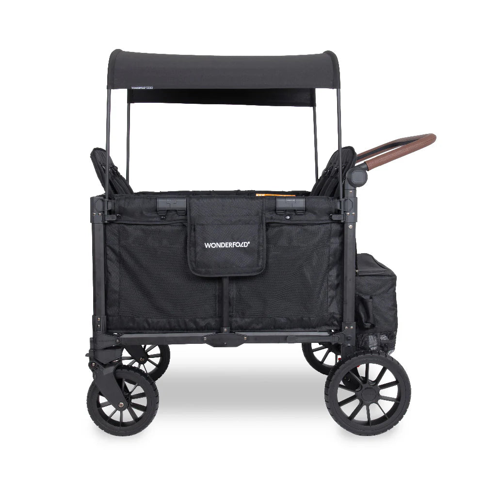 Wonderfold Stroller wagon in black side view with canopy on and handle pulled out on a white background. 