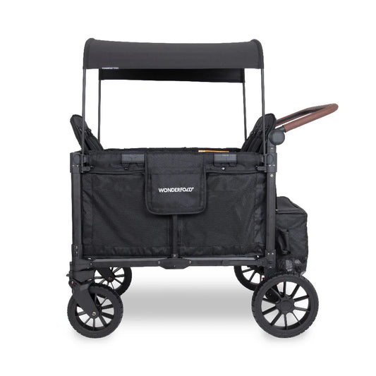 Wonderfold Stroller wagon in black side view with canopy on and handle pulled out on a white background. 