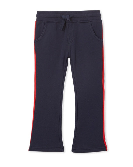 Navy Track pant with Draw string waist and slight flair. Red and White strip down side of leg. 